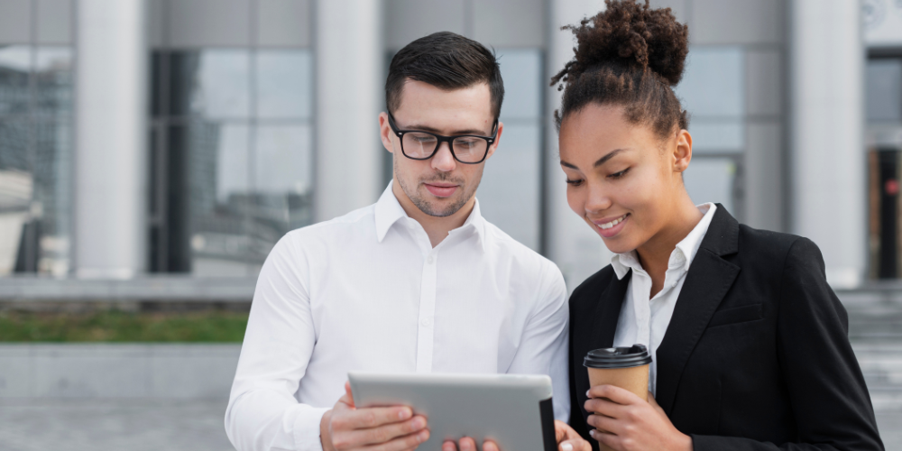 Man Showing Ipad To His Colleague
